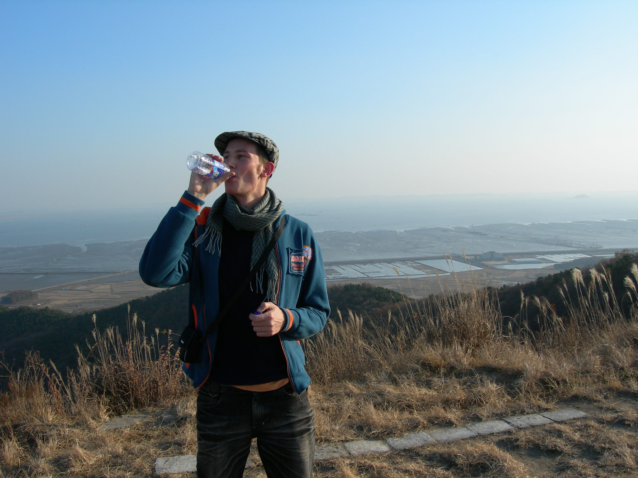 Joa drinking water above Yeongjong during a Sunday mountain walk in 2005